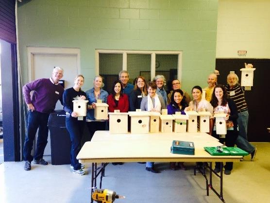 Valencia College faculty & students pose with animal boxes.